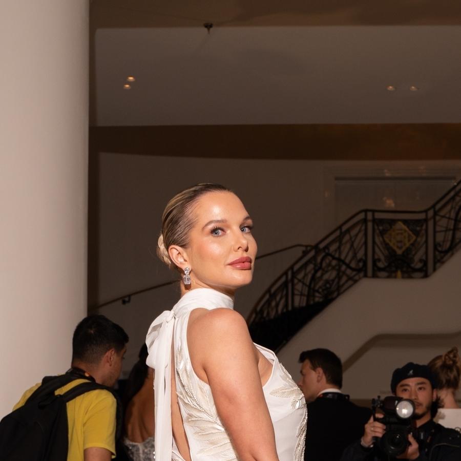 Helen Flanagan turned heads as she arrived at the iconic Martinez Hotel, wearing a flowing white Karen Millen maxi dress Helen Flanagan turned heads as she arrived at the iconic Martinez Hotel, wearing a flowing white Karen Millen maxi dress
